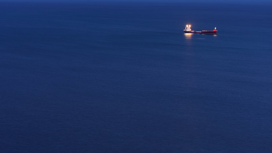 a small boat in a large body of water