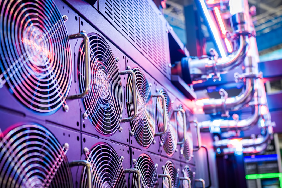 Close-up of server cooling fans in a vibrant data center.