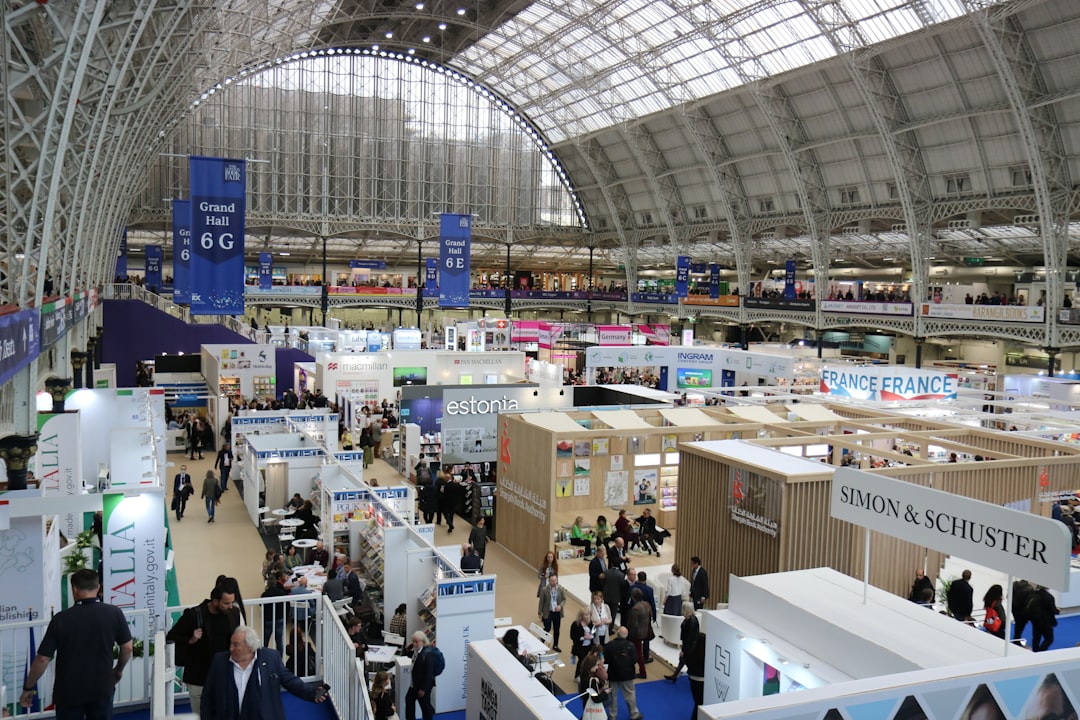 Busy exhibition hall with many booths and attendees
