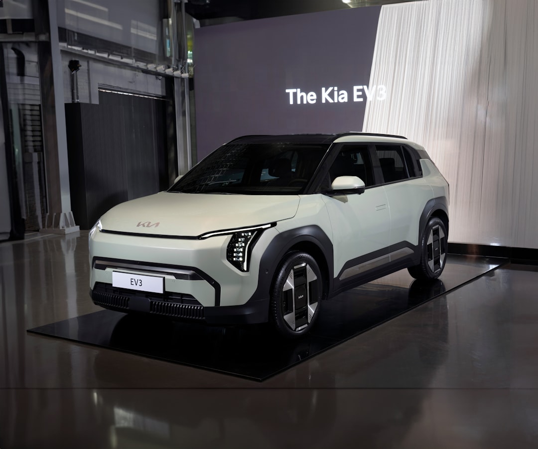 A white suv is on display in a showroom