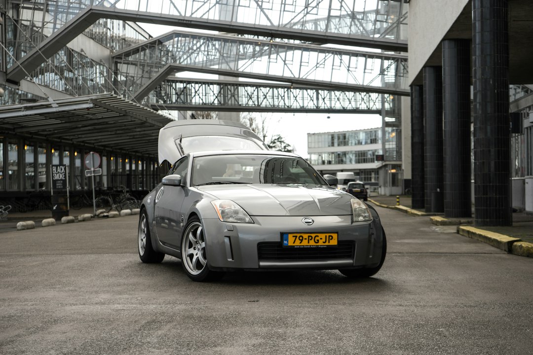 silver porsche 911 parked in garage