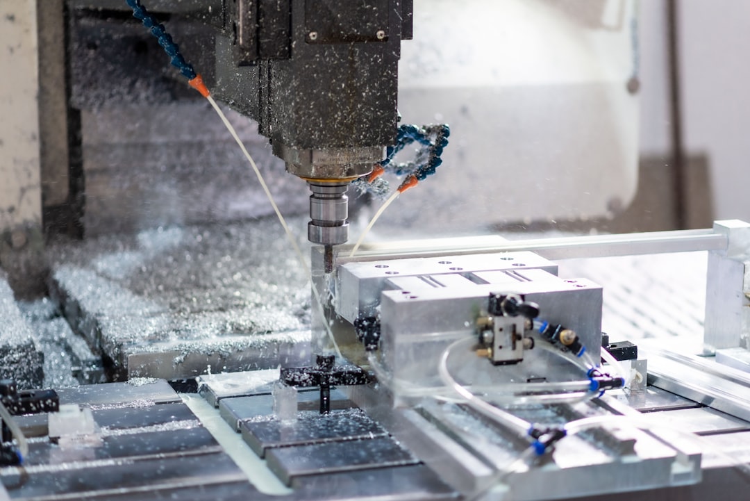 A machine that is cutting a piece of metal