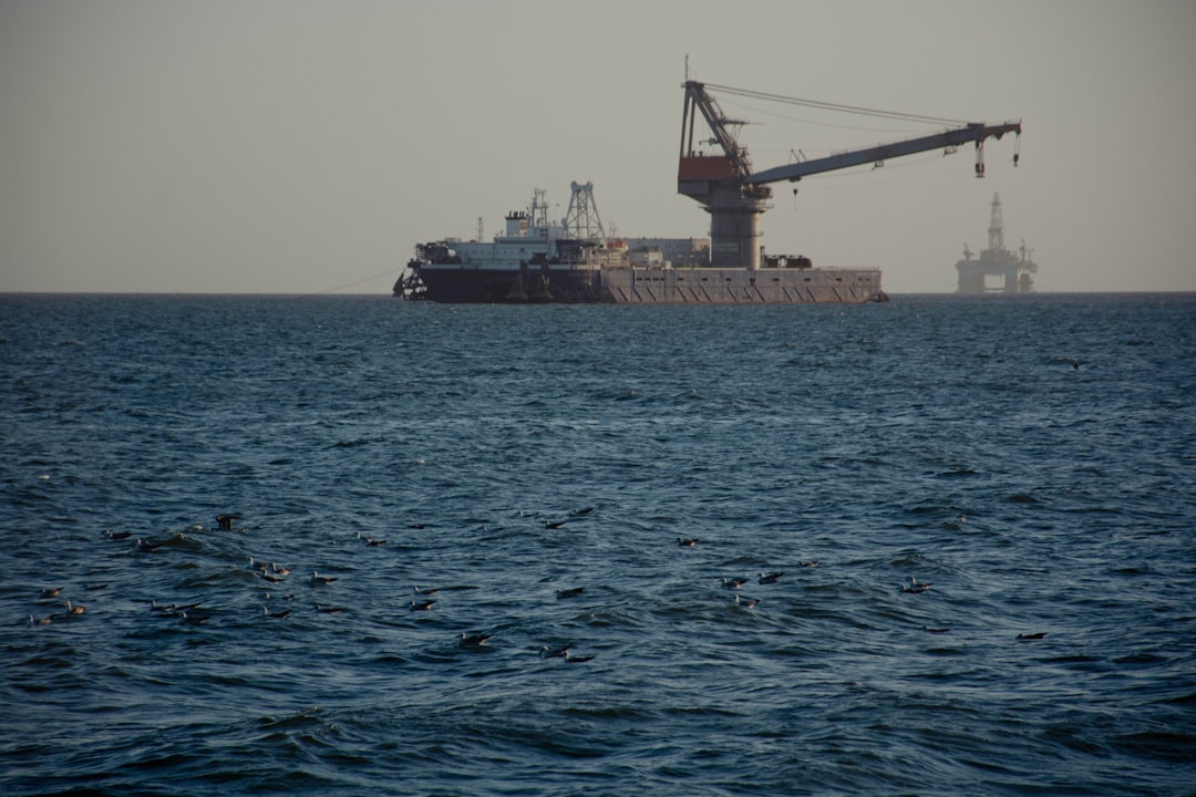 A large boat floating on top of a large body of water
