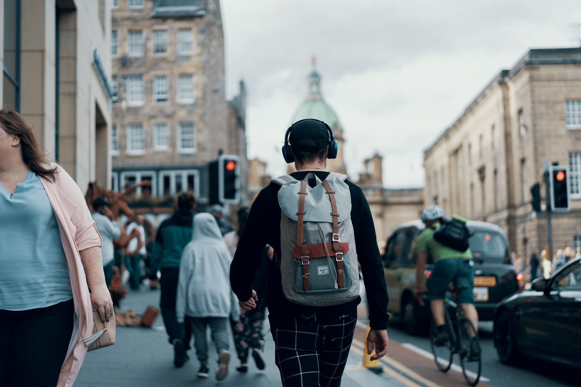 Crowds walking along the Royal Mile in Edinburgh during festival season. Photo by Ross Sneddon on Unsplash (unsplash.com/@rosssneddon)